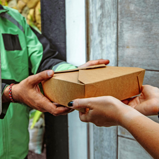 Cannabis delivery to the doorstep, featuring a person receiving a package
